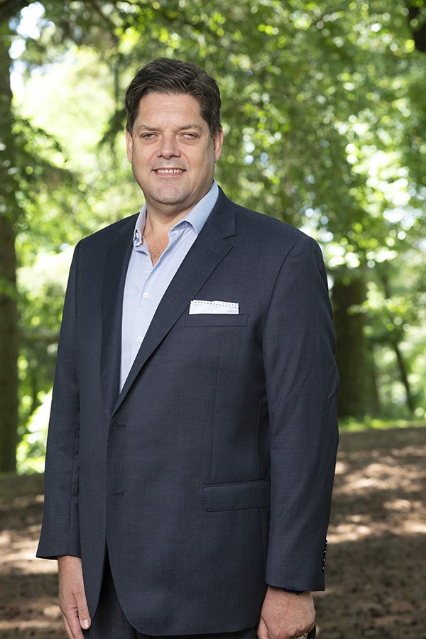 Cr Tony Clark standing in the Wombat Hill Botanic Gardens