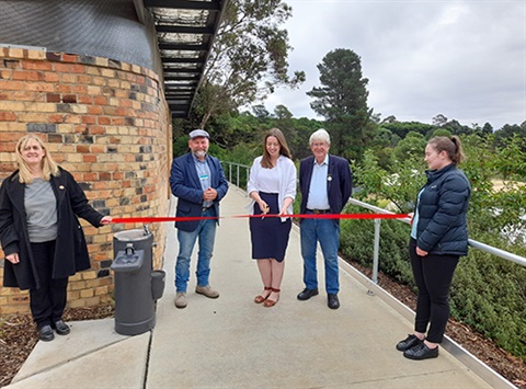 Cr Hood, Martha Haylett MP, Councillor Don Henderson and Bruce Lucas cutting a ribbon