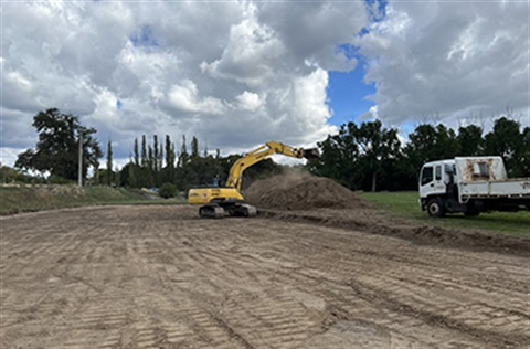 Excavator at Hammon Park removing soil