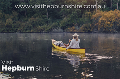 Lady in a canoe on Lake Daylesford